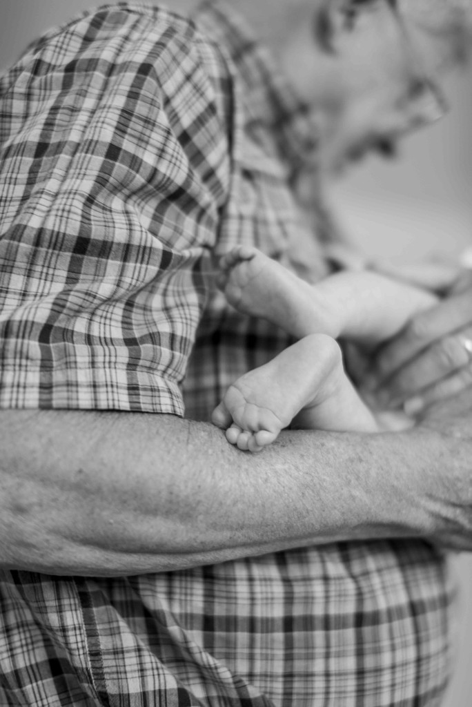 grandfather and baby feet